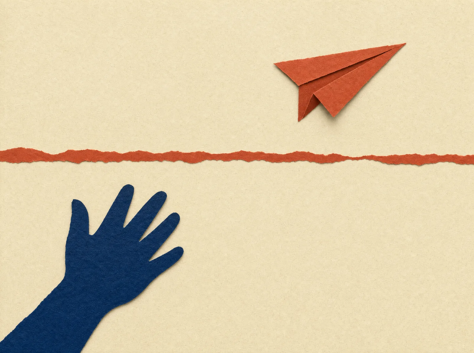 An open paper hand has just let go; a small red paper plane is in flight above the line.